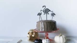 Use your Cricut to cut out these Skeleton Flamingo Cake Toppers for your Halloween party! // Salty Canary