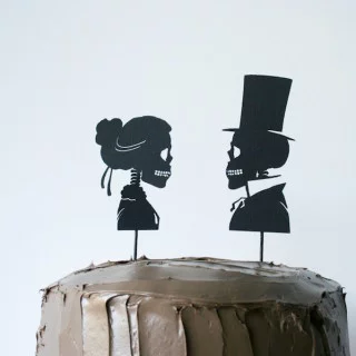 Use your Cricut to cut out these Skeleton Silhouette Cake Toppers for your Halloween party! // Salty Canary