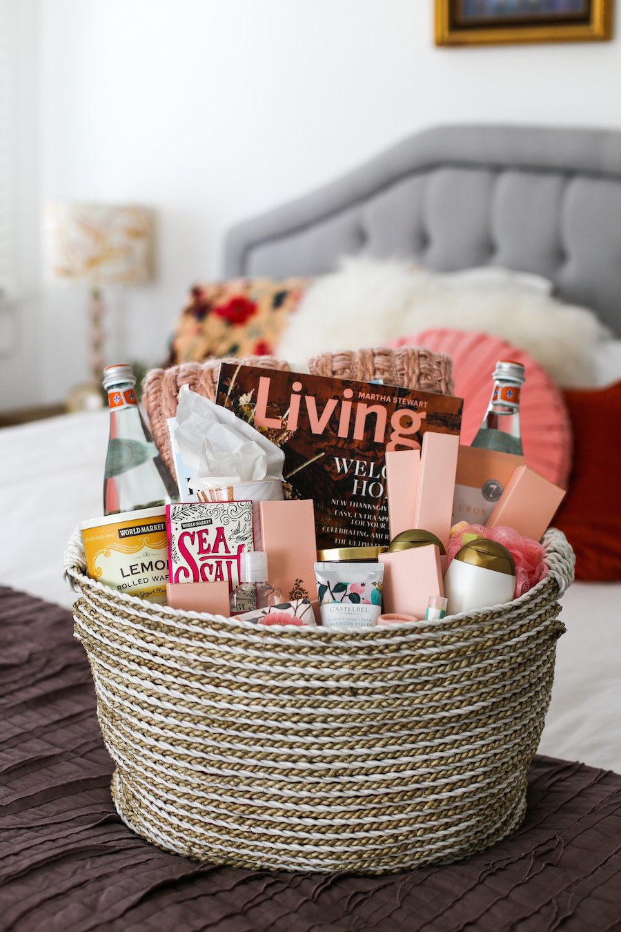 A houseguest welcome basket loaded with essentials and nonessentials to make holiday or overnight guests feel at home in the guest bedroom // Salty Canary