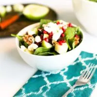 Winter Spinach Salad Recipe with Apples, Dried Cranberries, Pomegranate Seeds, Walnuts, and Feta Cheese