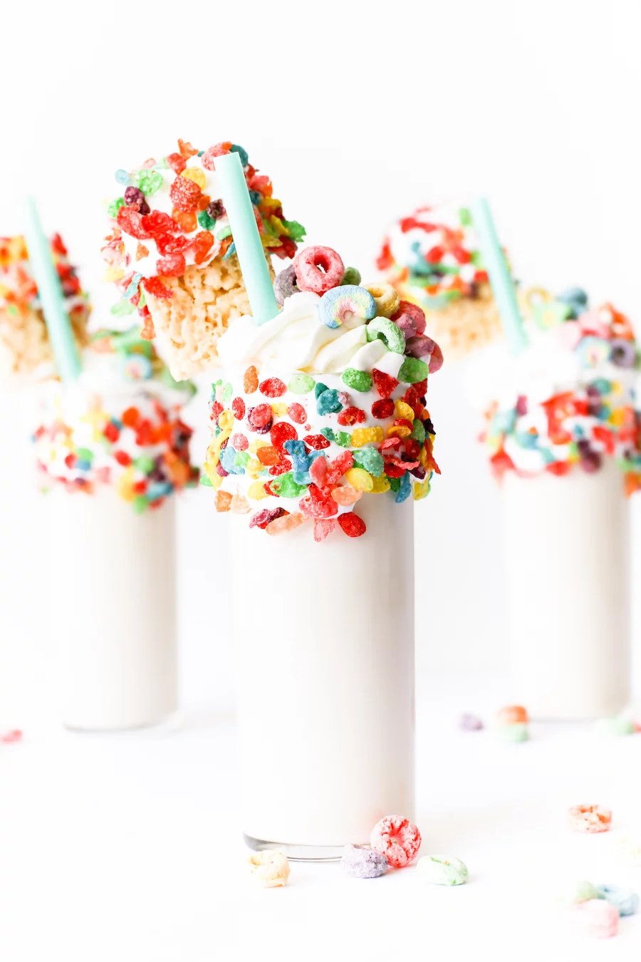 Splurge for breakfast or dessert with this cereal milk milkshake made with cereal-soaked milk, rice krispies treats, and a lot of marshmallow fluff! // Salty Canary 