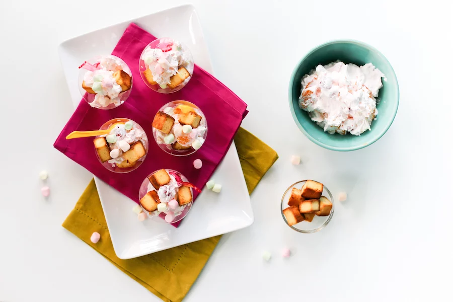 Try this throwback recipe with a fun twist: Ambrosia Salad with Pound Cake Croutons! Perfect for brunches, pool parties, tiki parties, or outdoor grilling! // saltycanary.com