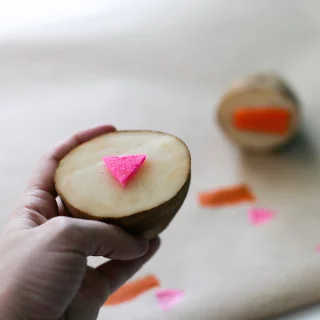 Upgrade your table cloth and brush up on your grade school art skills with this quick and easy DIY Potato Stamp! // Salty Canary