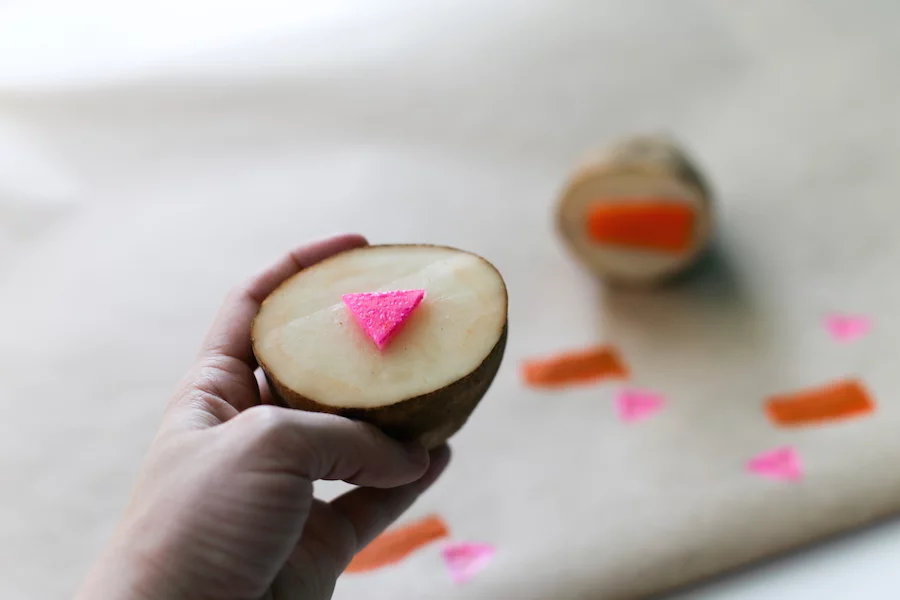 Upgrade your table cloth and brush up on your grade school art skills with this quick and easy DIY Potato Stamp! // Salty Canary