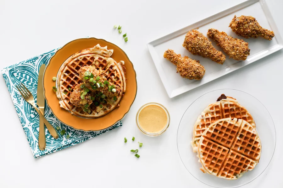 Try this fake baked fried chicken with savory waffles drizzled with a honey mustard sauce! // saltycanary.com