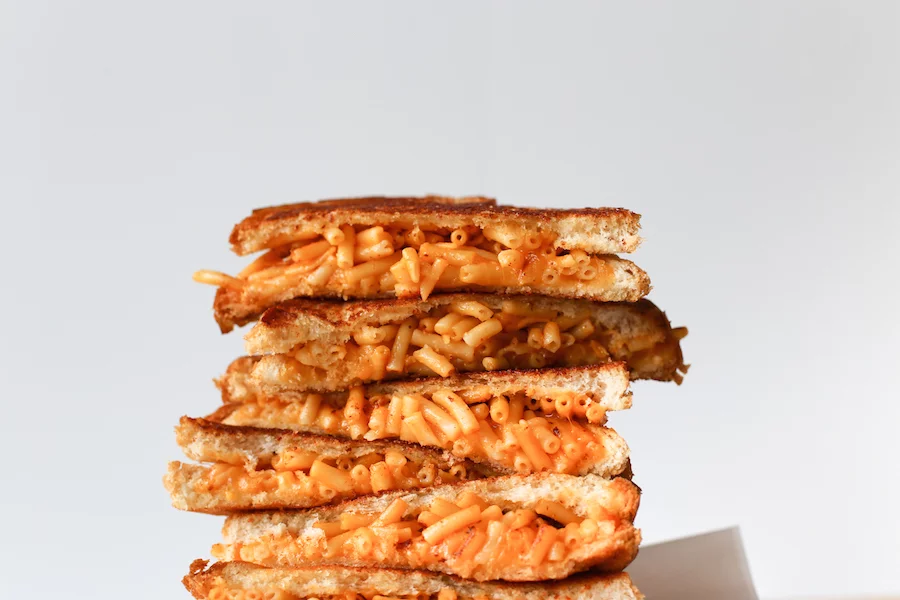 Mac And Cheese Grilled Cheese Sandwich // This is one comfort food stuffed into another comfort food and then grilled to perfection! // saltycanary.com