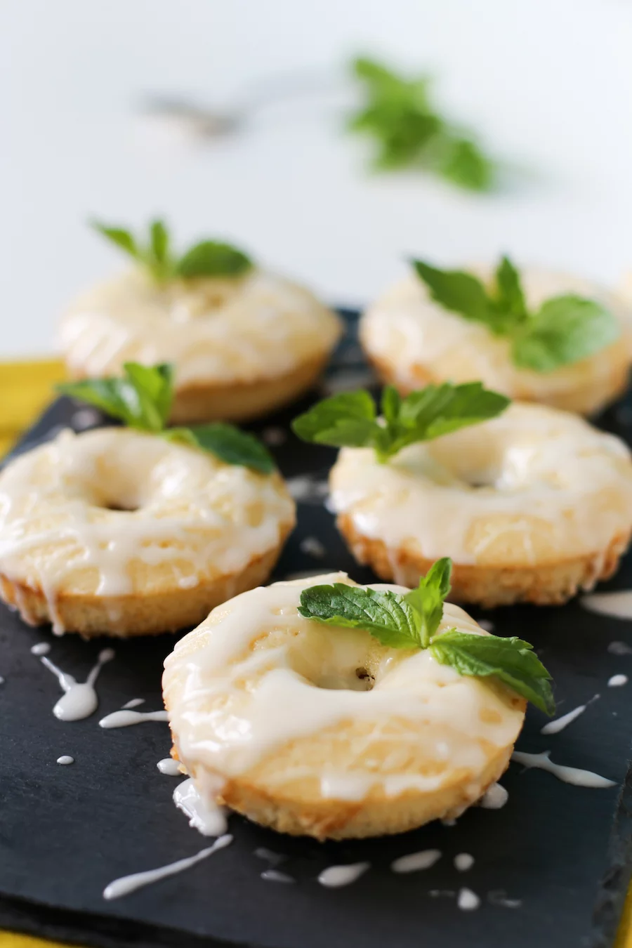 Celebrate the Kentucky Derby at home with these Mint Julep Donuts! A minty lemon baked donut with a delicious bourbon glaze! // saltycanary.com
