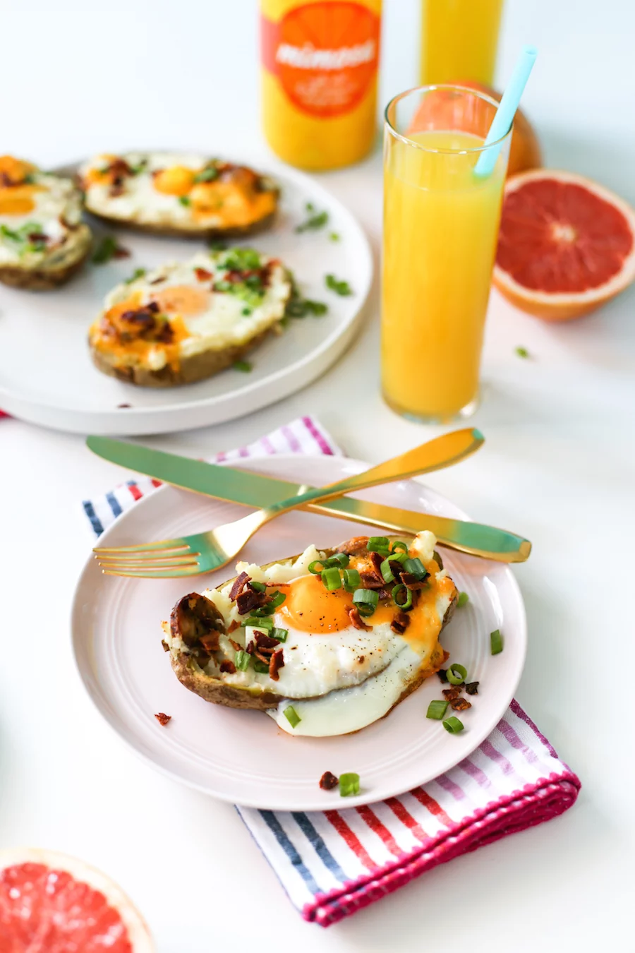 Try making these twice baked breakfast potatoes filled with chicken sausage and topped with an egg, bacon, green onions, and cheese! It is sure to be a hit at your next brunch! | saltycanary.com
