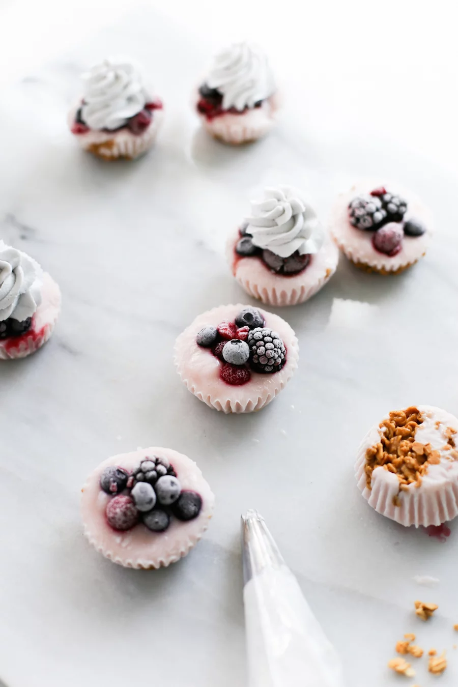 Since they're made in a cupcake pan, that makes them cupcakes right? No frosting, but add some blueberry whipped cream on top of these Yogurt Parfait Cupcakes! | saltycanary.com