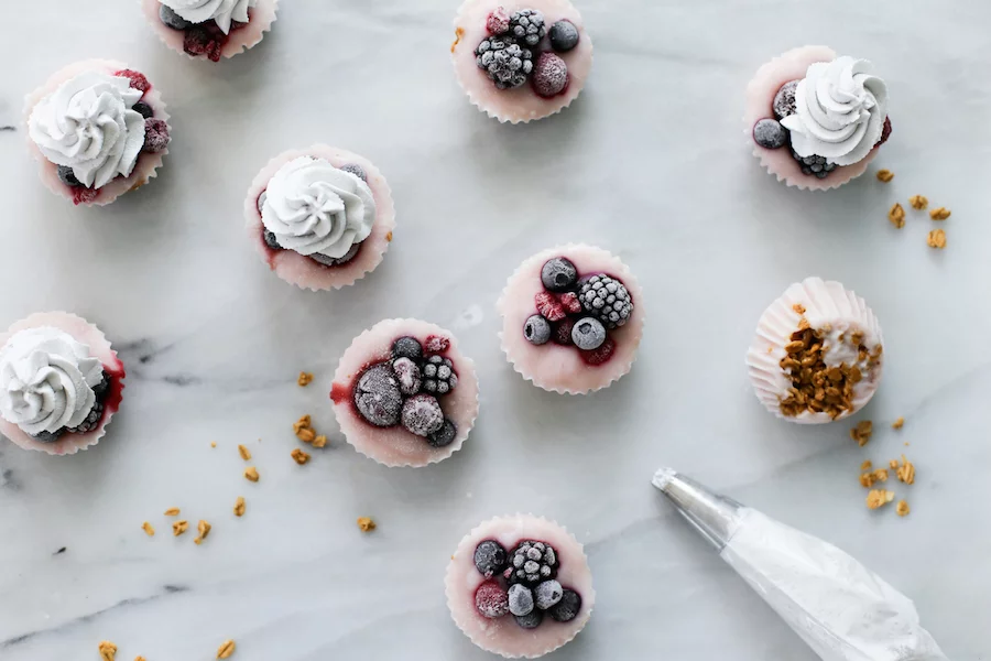 Since they're made in a cupcake pan, that makes them cupcakes right? No frosting, but add some blueberry whipped cream on top of these Yogurt Parfait Cupcakes! | saltycanary.com