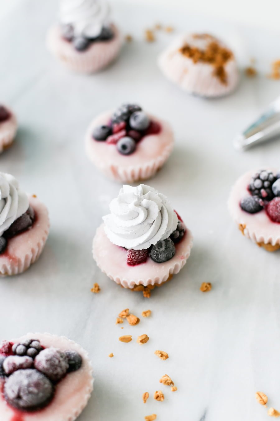 Since they're made in a cupcake pan, that makes them cupcakes right? No frosting, but add some blueberry whipped cream on top of these Yogurt Parfait Cupcakes! | saltycanary.com