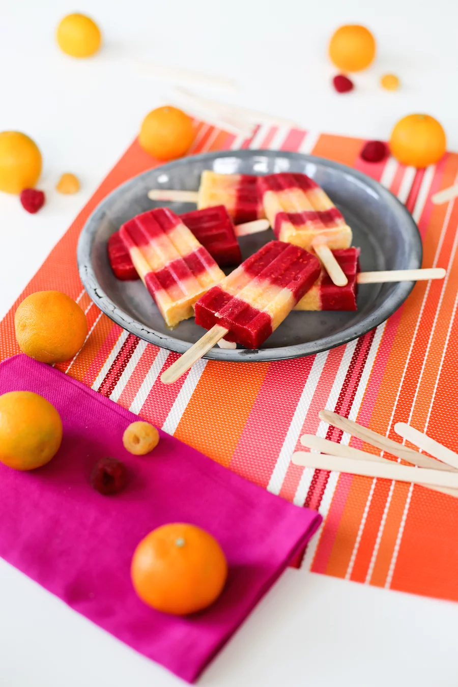 Cool off this summer with these Raspberry Tangerine Popsicles made with Emergen-C! // saltycanary.com