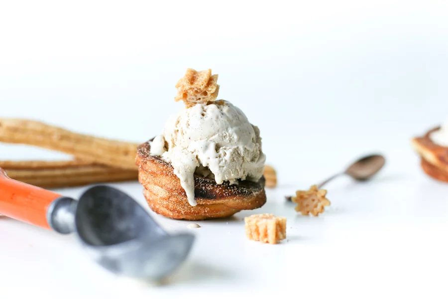 Go for churro overload and make this homemade Churro Ice Cream in homemade Churro Bowls! // Salty Canary