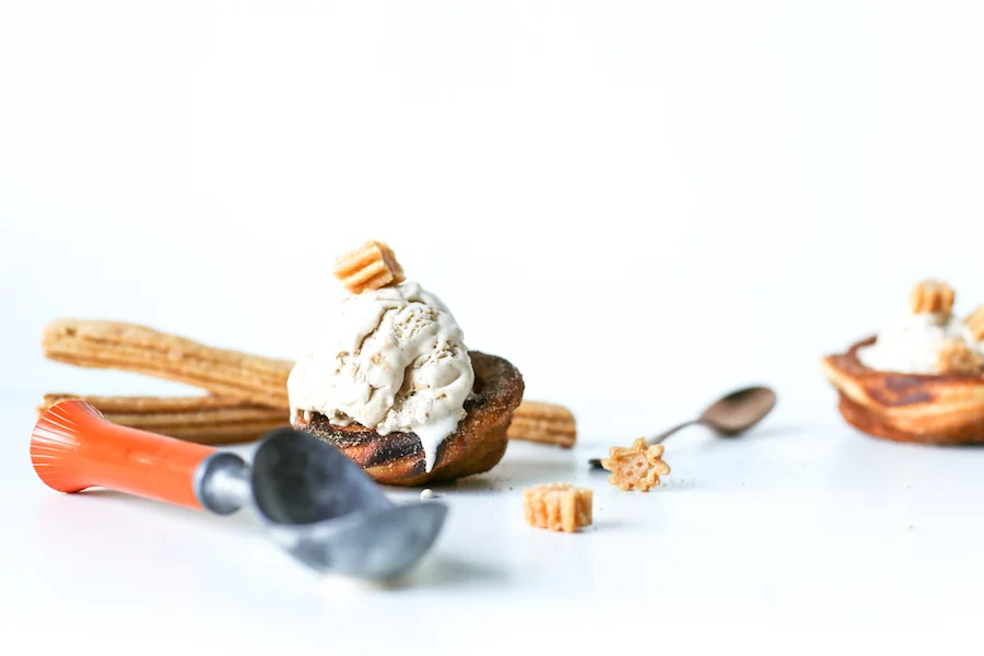 Go for churro overload and make this homemade Churro Ice Cream in homemade Churro Bowls! // Salty Canary