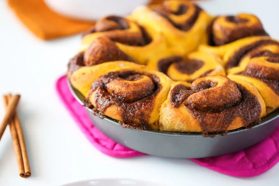 Pan of unfrosted Pumpkin Spice Cinnamon Rolls