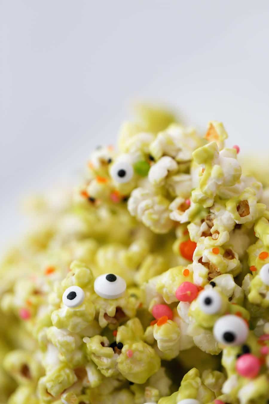 Halloween Monster Popcorn, Monster Munch Popcorn, Halloween party popcorn, candied popcorn, green popcorn, eyeballs, gooey popcorn, Salty Canary