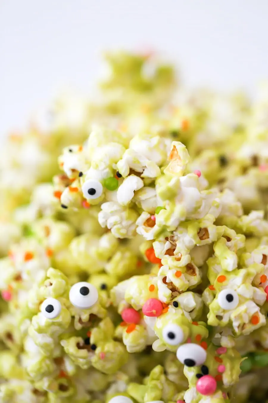 Halloween Monster Popcorn, Monster Munch Popcorn, Halloween party popcorn, candied popcorn, green popcorn, eyeballs, gooey popcorn, Salty Canary