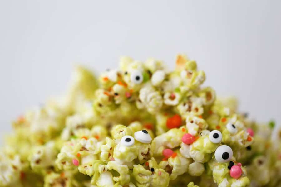 Halloween Monster Popcorn, Monster Munch Popcorn, Halloween party popcorn, candied popcorn, green popcorn, eyeballs, gooey popcorn, Salty Canary