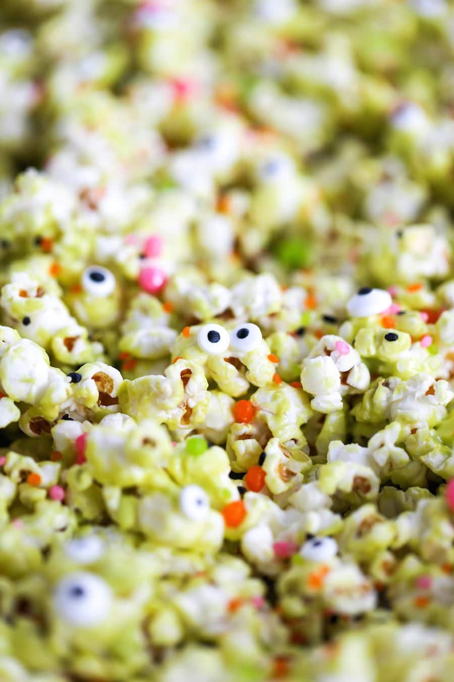 Halloween Monster Popcorn, Monster Munch Popcorn, Halloween party popcorn, candied popcorn, green popcorn, eyeballs, gooey popcorn, Salty Canary