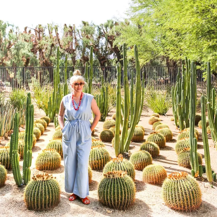 Woman standing in cactus garden at Sunnylands near Palm Springs