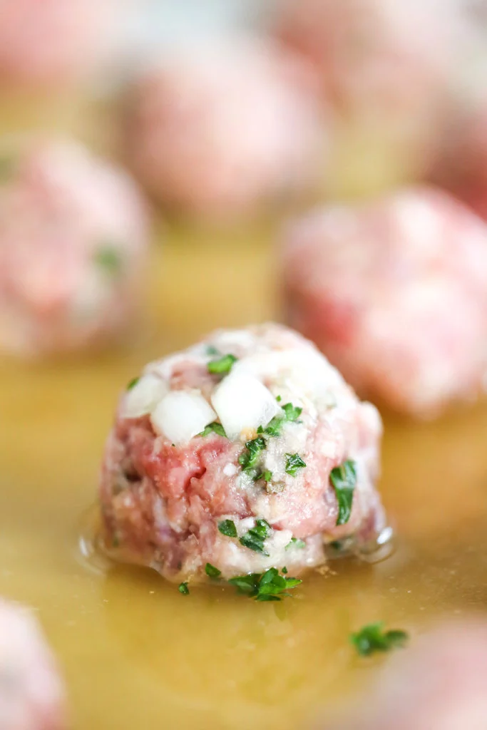 Freezer Friendly Meatballs Cooking in Beef Broth // Salty Canary