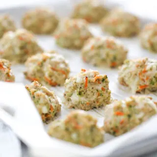 Cooked chicken meatballs on a baking sheet