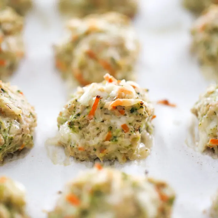 Cooked chicken meatballs on a baking sheet