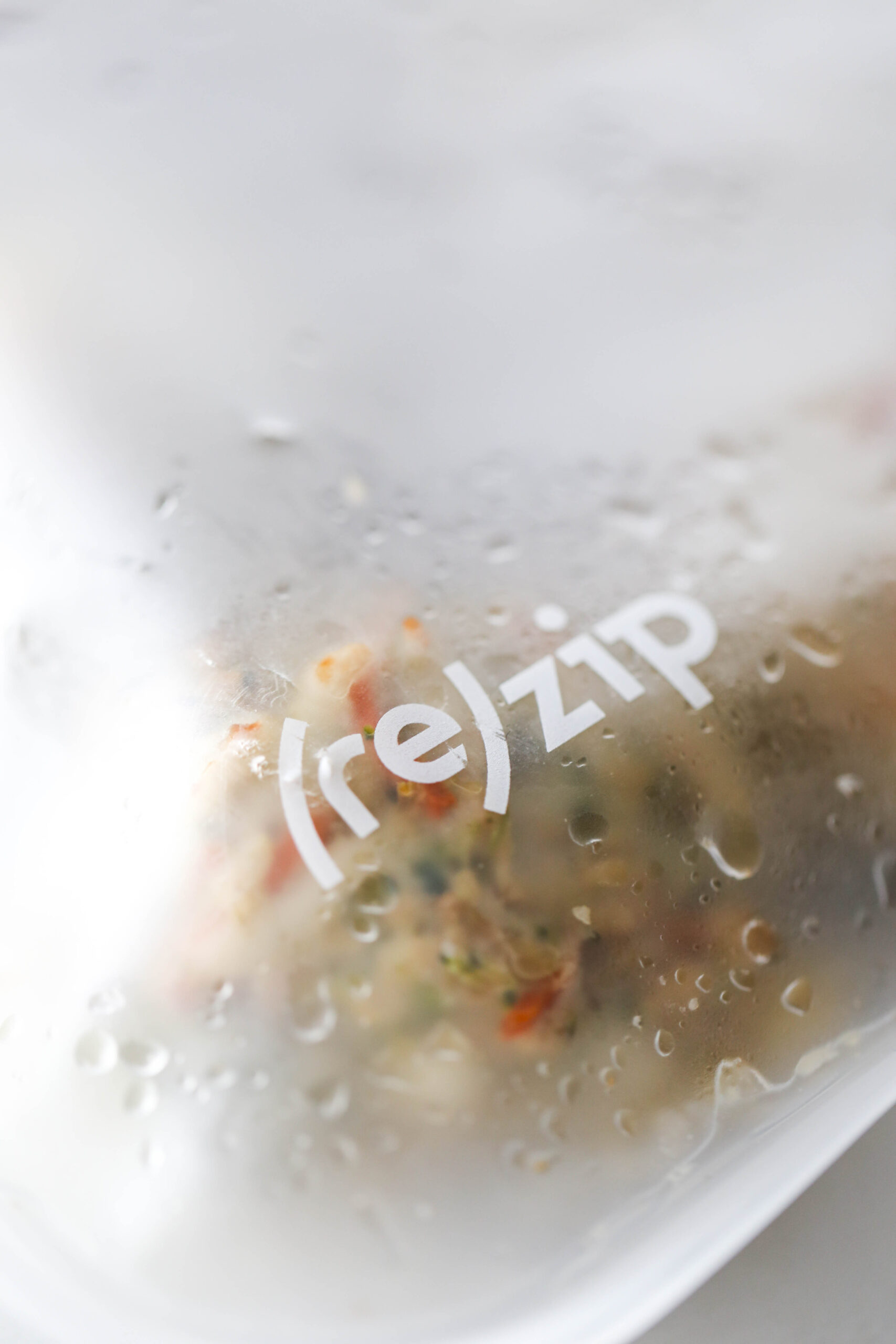 Close-up of freezer bag logo which reads (re)zip