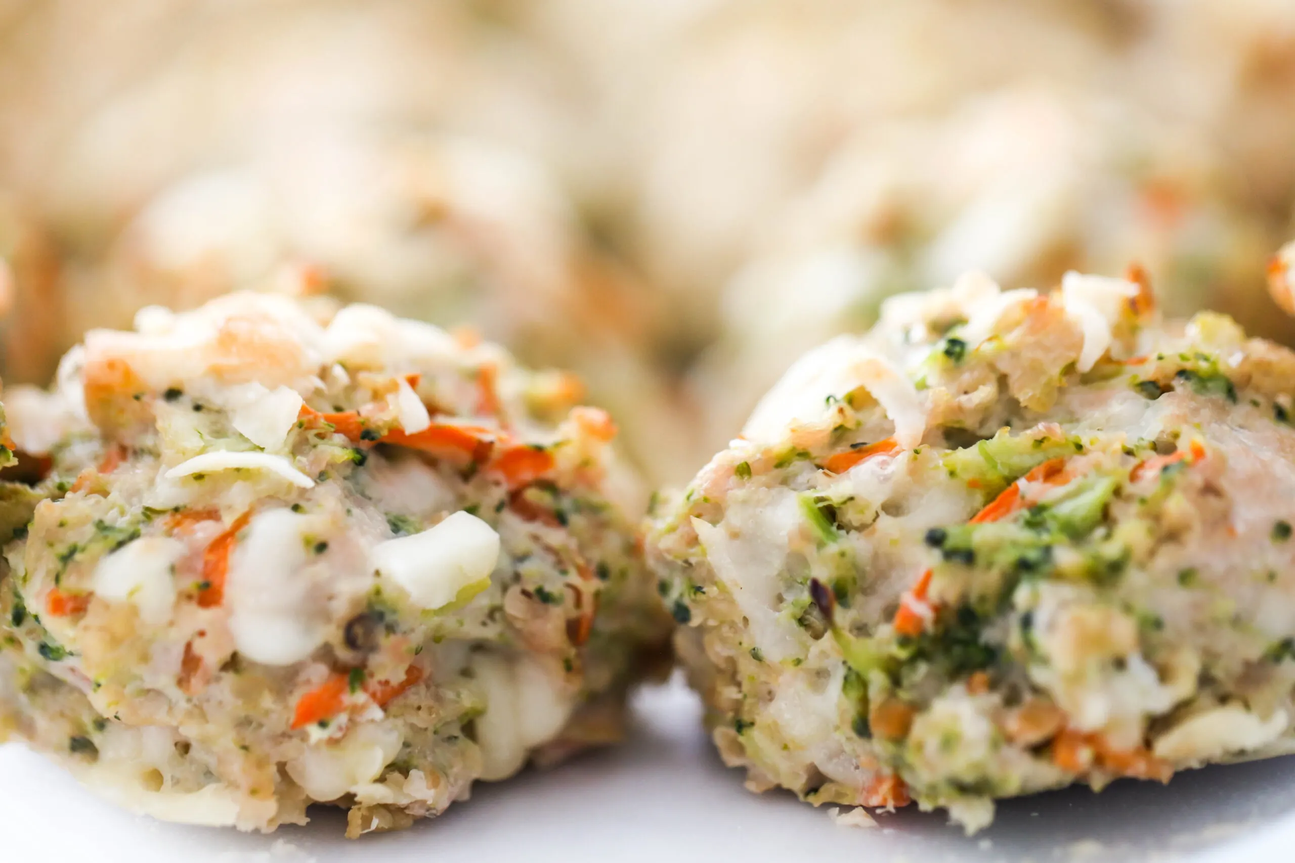 Two frozen chicken meatballs in a freezer bag