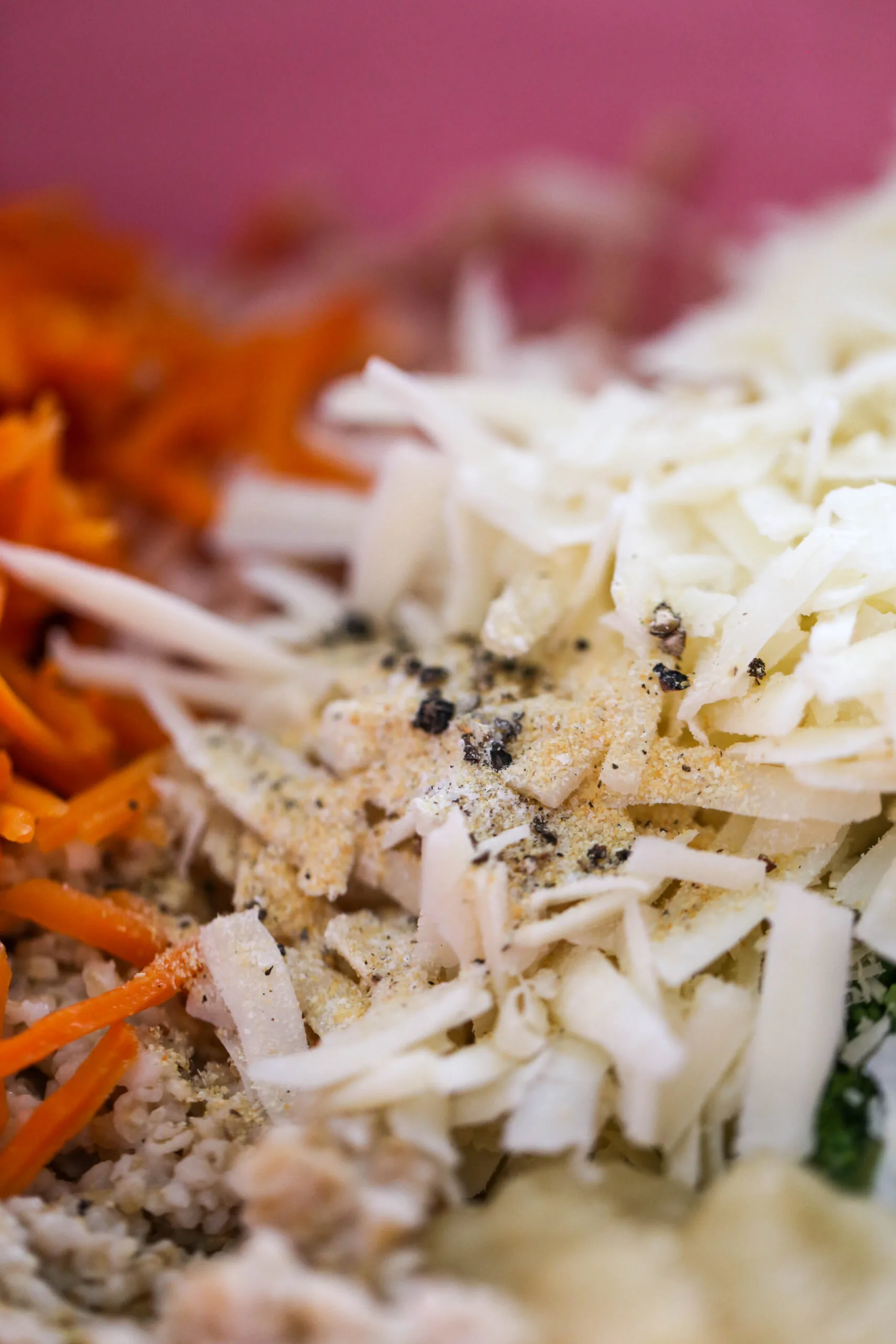 Close up of chicken meatball ingredients in a bowl about to be mixed